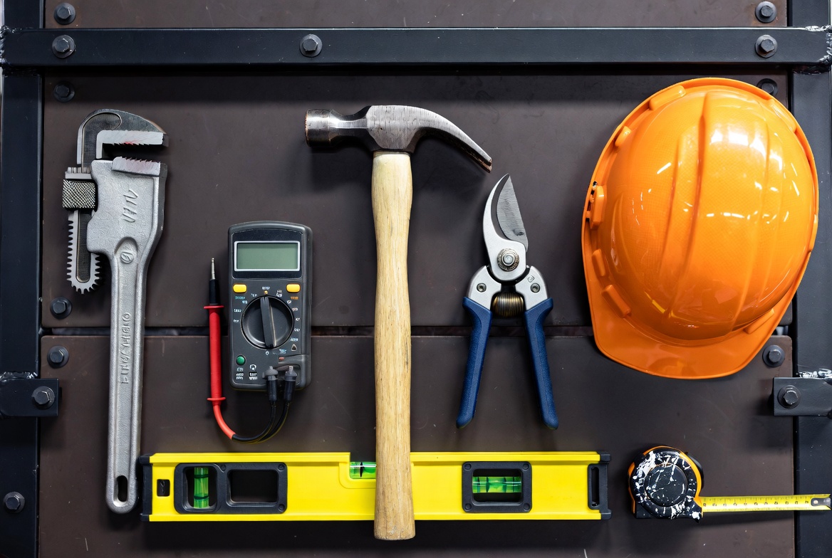 A tradesperson at work with tools on a job site